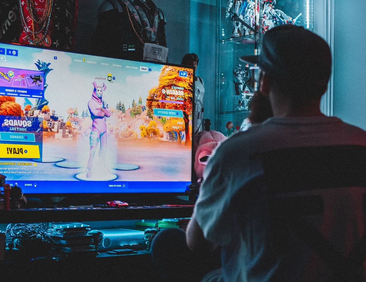 Person playing video games on gaming console